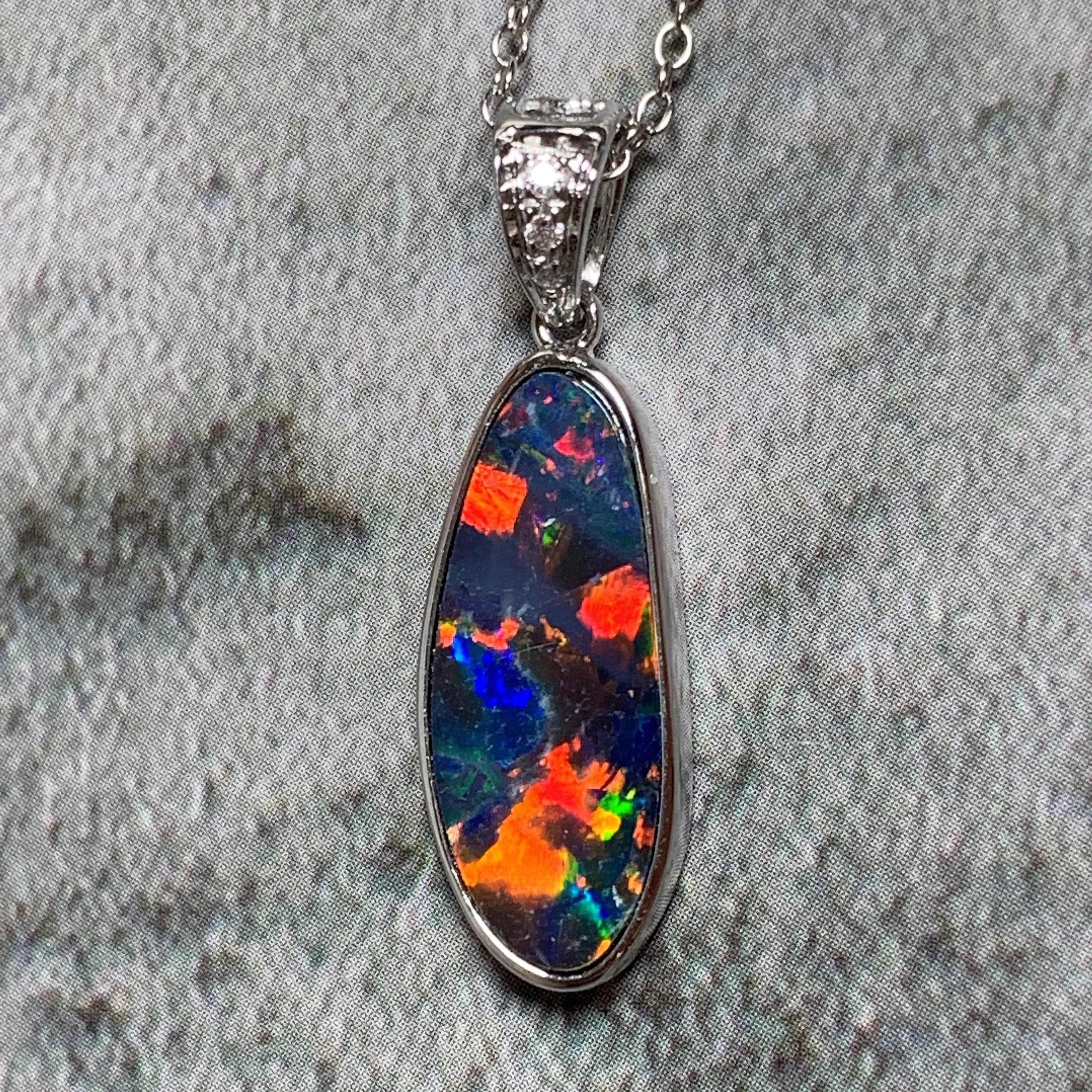 14kt White Gold Fire Opal 17.8x6.6mm and Diamond pendant