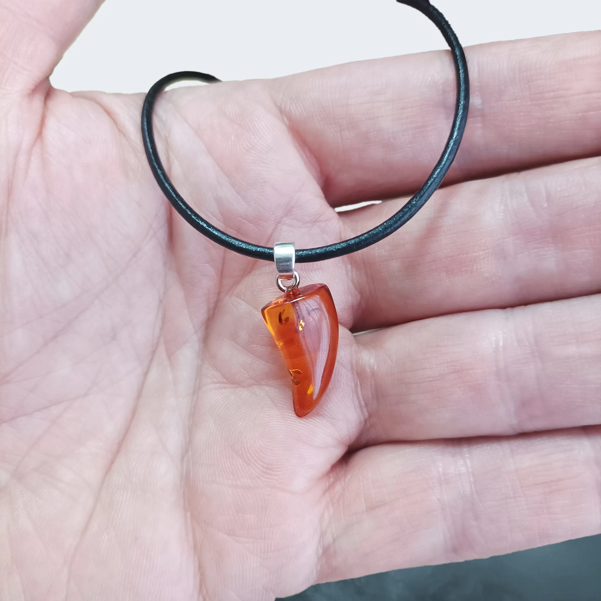 Amber Tooth Pendant with Silver Hanger