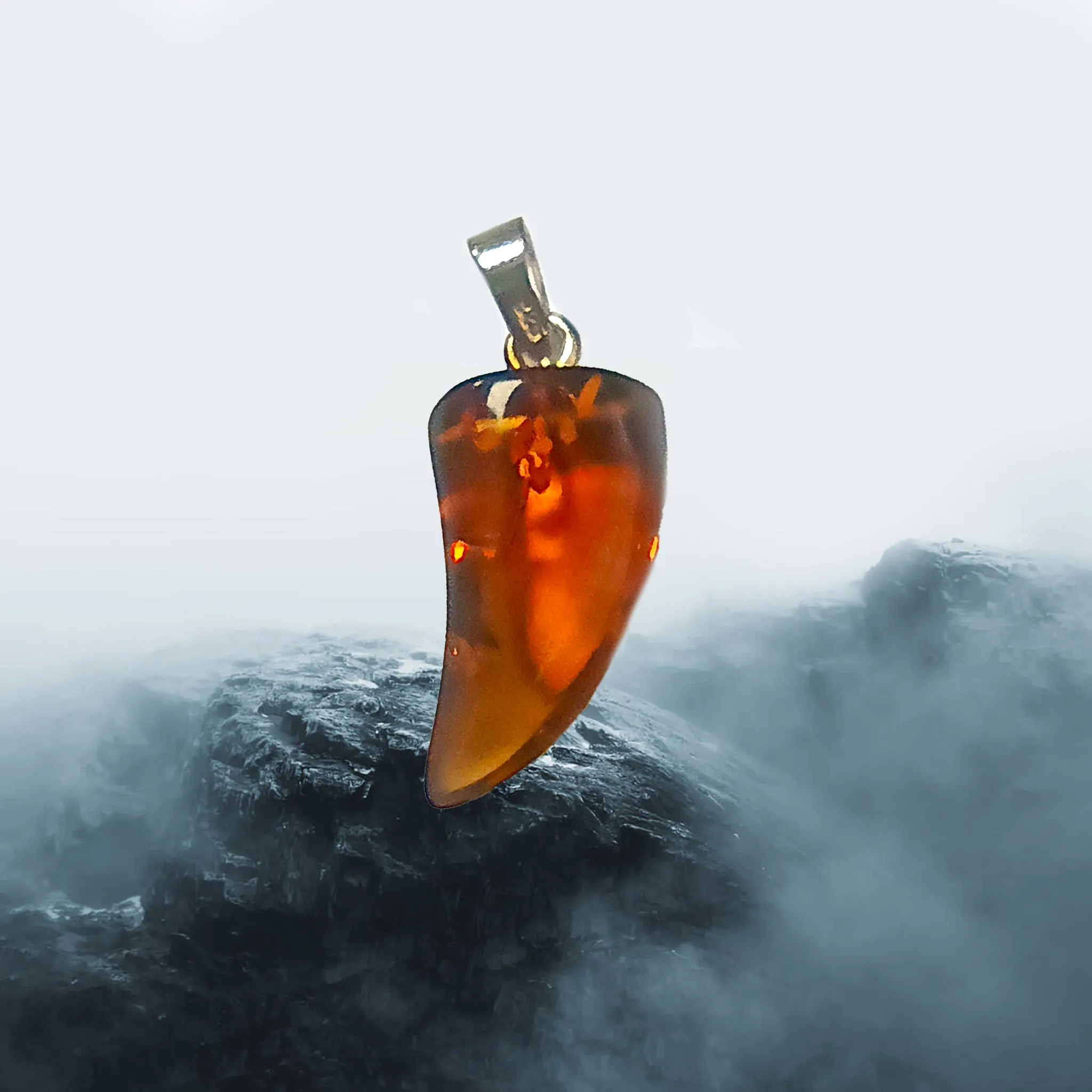 Amber Tooth Pendant with Silver Hanger