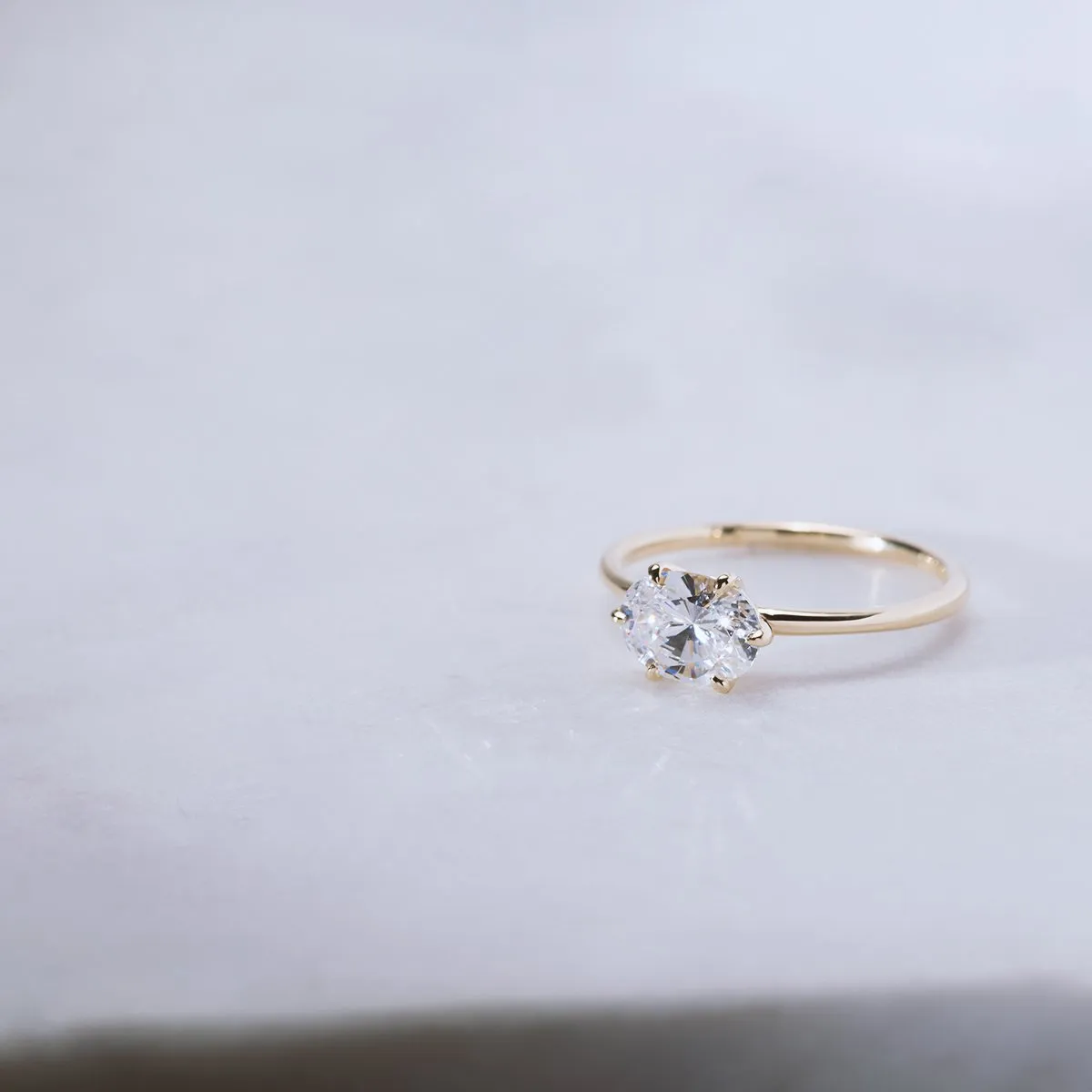 East-West Halo Diamond Engagement Ring