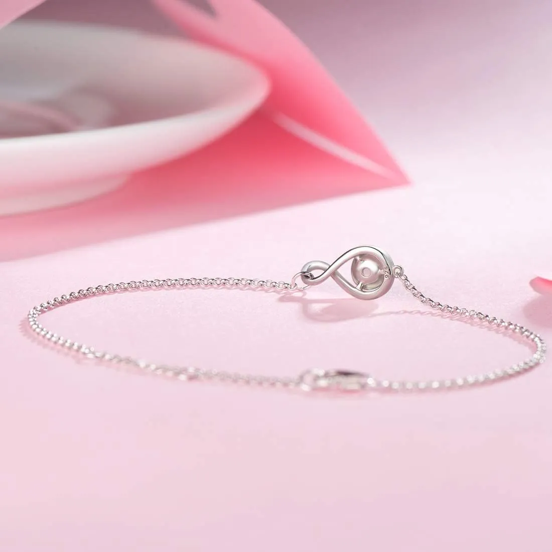 "Infinite Embrace" Pink Quartz Infinity Symbol Sterling Silver Bracelet